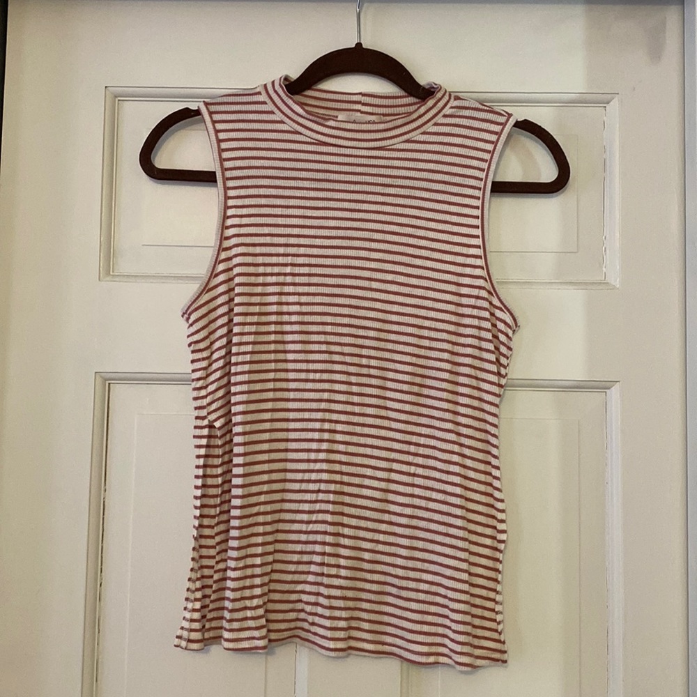 High neck, loose tank. Worn maybe once or twice.